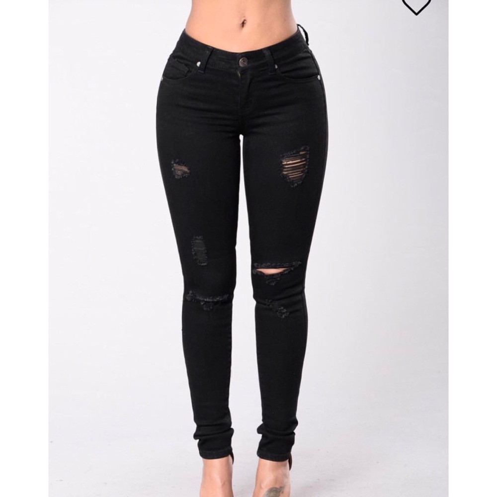 Black ripped skinny jeans.